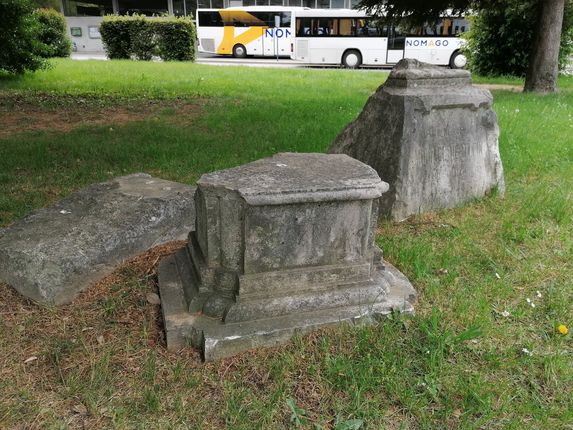 . Three gravestones from the former cemetery near the bus station &copy;Photo: Blaž Kosovel