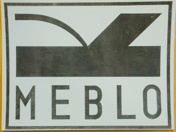 . The Meblo logo depicts a stylised wood shaving and a hand plane – a traditional woodworking tool used for shaping wood. &copy;From the collection of Regional Archive in Nova Gorica - PANG 0415 Meblo Nova Gorica, t.e. 427