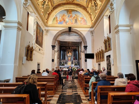 . Interior of the church, where local guide Mirjam Brecelj presents the history and points of interest of the monastery to visitors. &copy;Photo: Blaž Kosovel